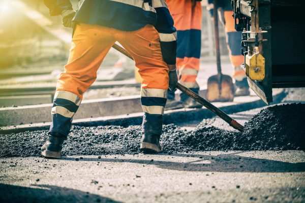 Teamwork, Group of workers on a road construction, team of people at work